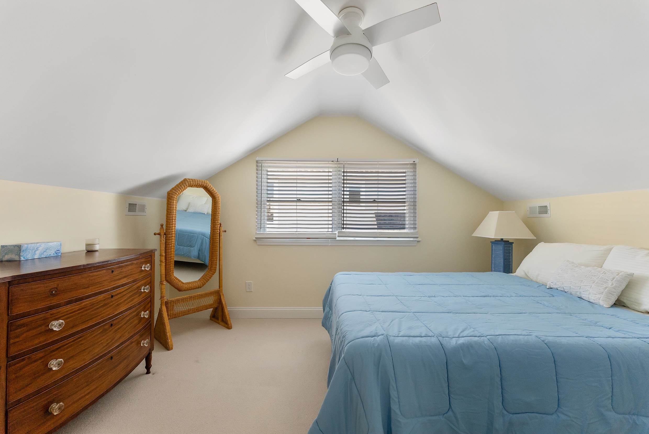 274 52nd Street Avalon, NJ 08202 - Photo 39 of 39 a bedroom with a bed and a chandelier