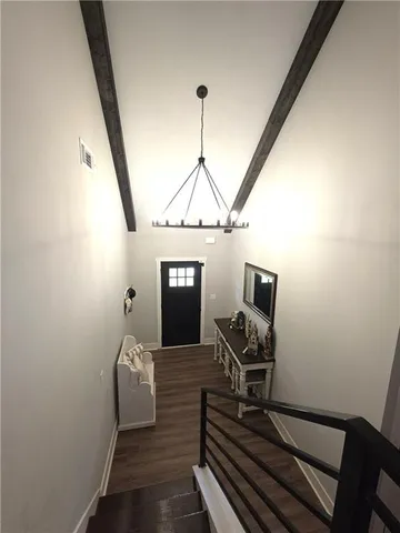 a view of a workspace with wooden floor