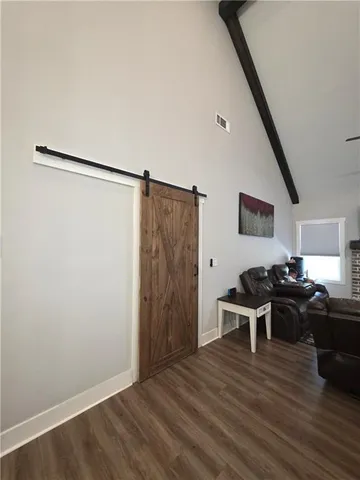 a bedroom with bed and a chandelier