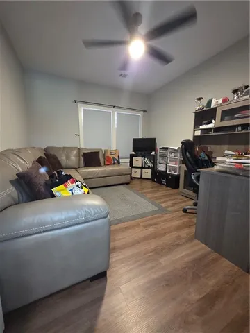 a bed sitting in a bedroom next to a lamp