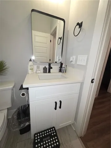 a bathroom with a toilet and a shower curtain