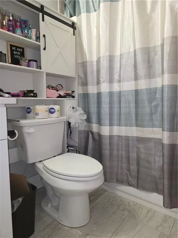 a room with stove and cabinets