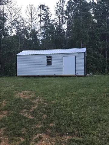 a view of a field with a trees