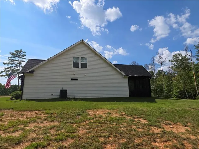 a view of a backyard of the house