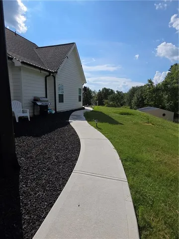 a view of a backyard with potted plants