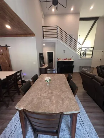 a large kitchen with a table and chairs