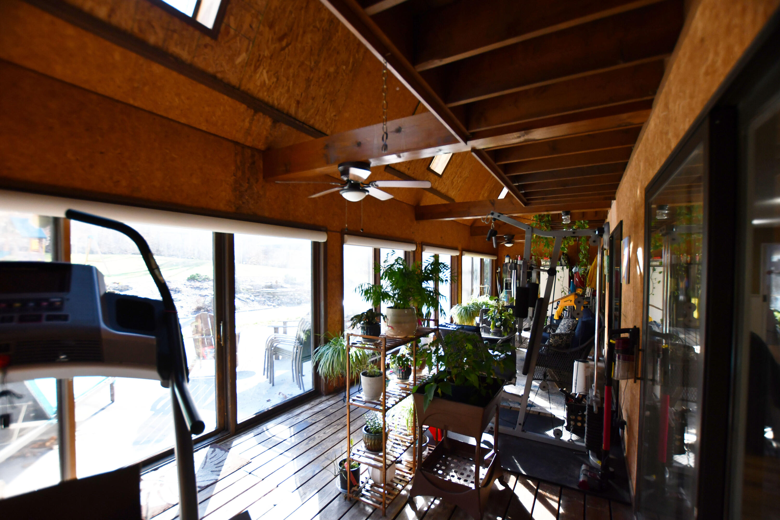 820 Sweet Lick Road Ravenna, KY 40472 - Photo 30 of 73 Sunlit solarium with skylights and wall-to-wall windows!