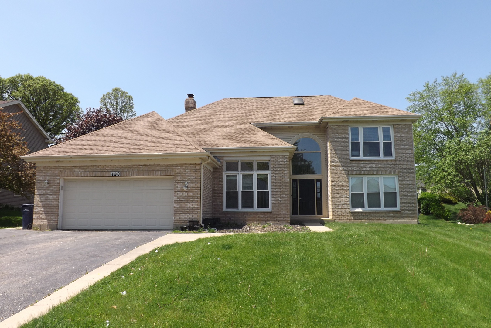 120 Arquilla Drive Algonquin, IL 60102 - Photo 1 of 18 a front view of a house with a garden and yard