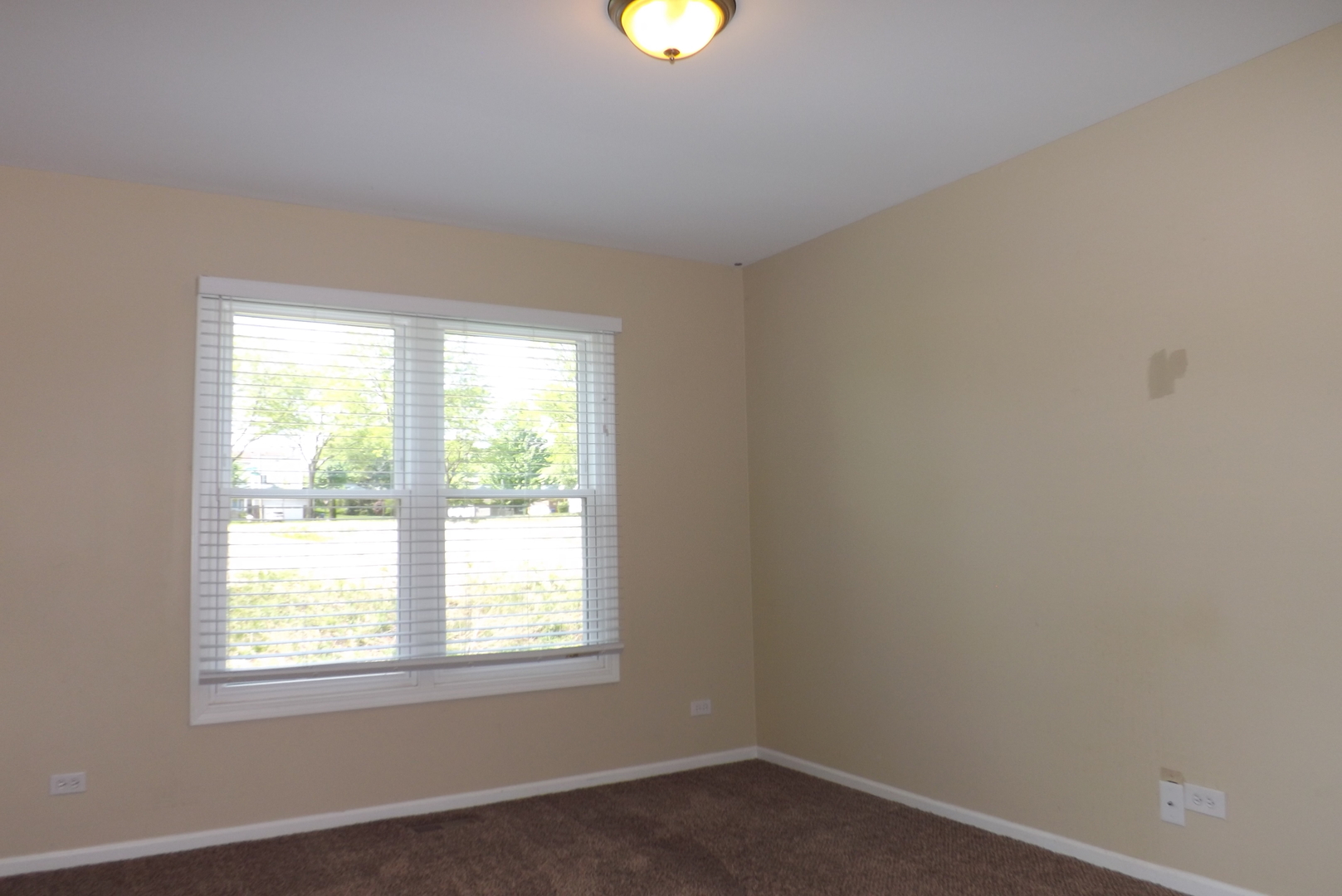 120 Arquilla Drive Algonquin, IL 60102 - Photo 16 of 18 wooden floor in an empty room with a window