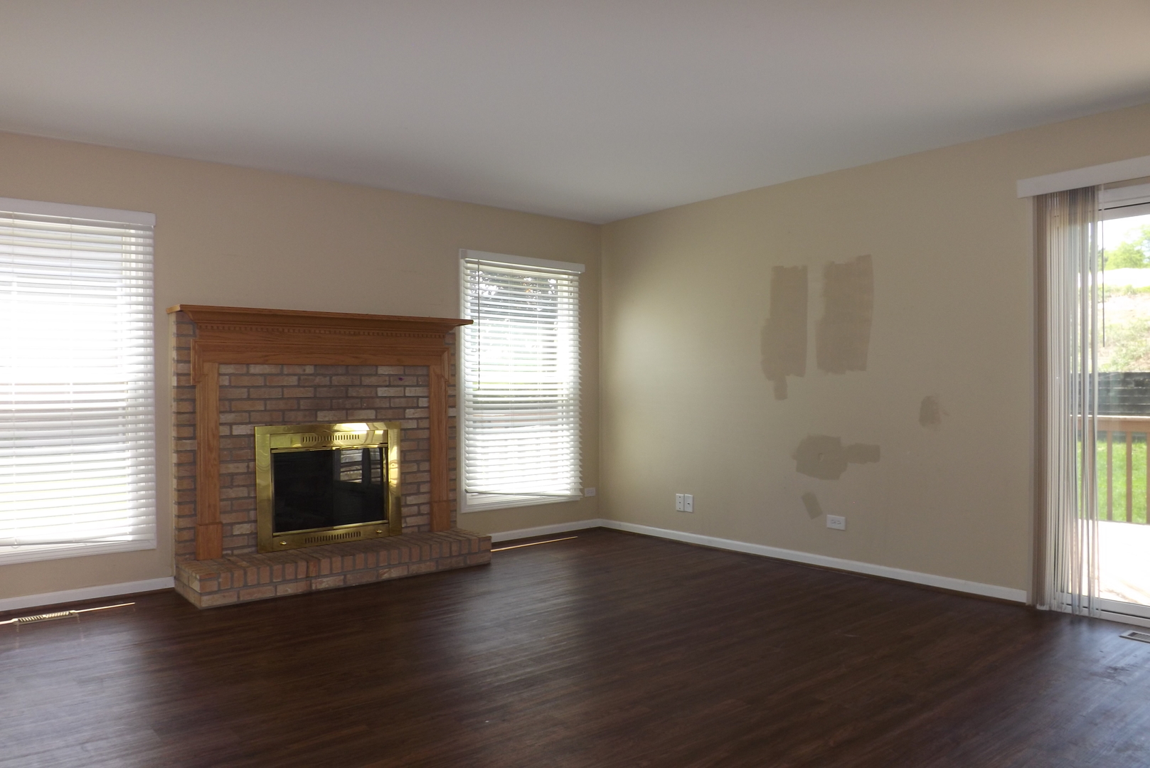 120 Arquilla Drive Algonquin, IL 60102 - Photo 6 of 18 an empty room with wooden floor and fireplace