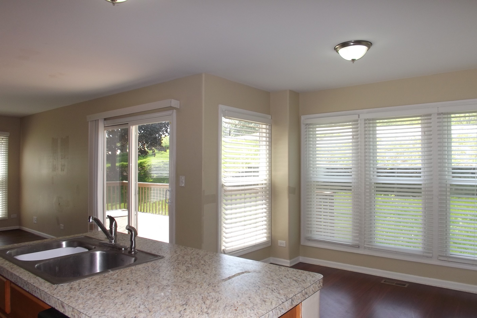120 Arquilla Drive Algonquin, IL 60102 - Photo 8 of 18 a kitchen with granite countertop a sink and a window