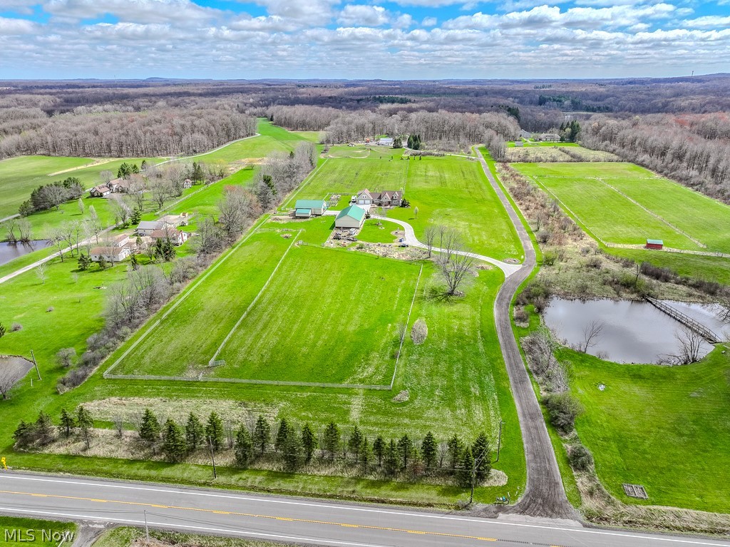 18919 Ravenna Road Chagrin Falls, OH 44023 - Photo 45 of 48 Drone photo of the property looking east. Notice the fenced pasture areas up front and in the back. To the right of the back pasture is a large hay field if you desire.