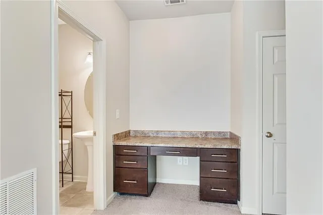 a bathroom with a sink toilet and mirror