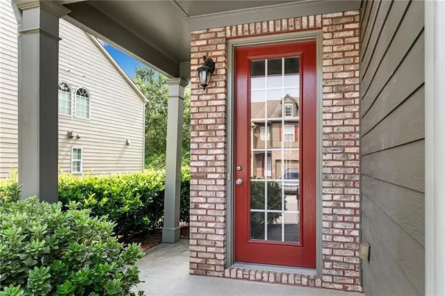 a view of a door and a window