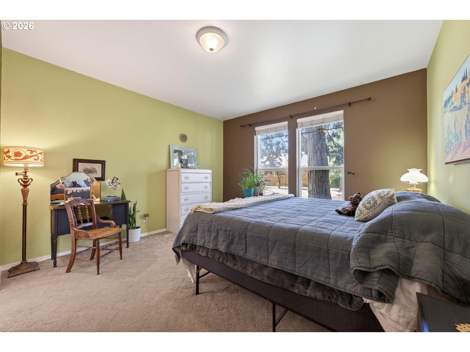 538 North Tam Rim Drive Sisters, OR 97759 - Photo 18 of 45 a bedroom with a bed a table and chair