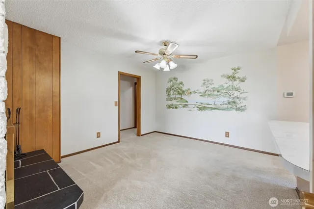 a large kitchen with stainless steel appliances granite countertop a stove and a sink