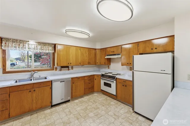 a kitchen with a stove and a microwave
