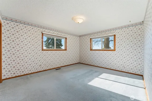 a view of a hallway with a wooden door