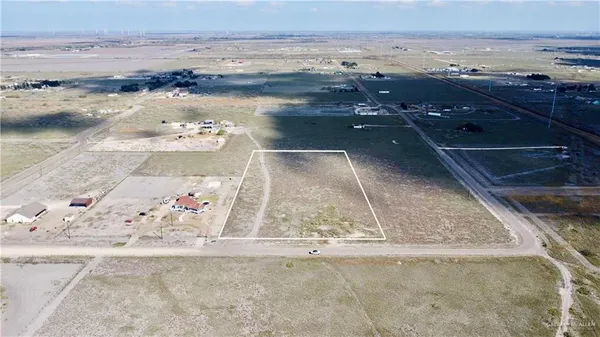 an aerial view of beach and ocean