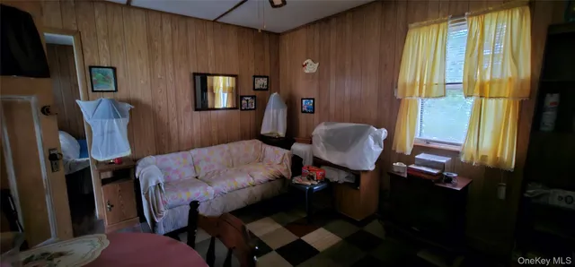 a living room with furniture and a window