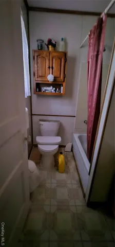 a living room with furniture and rug