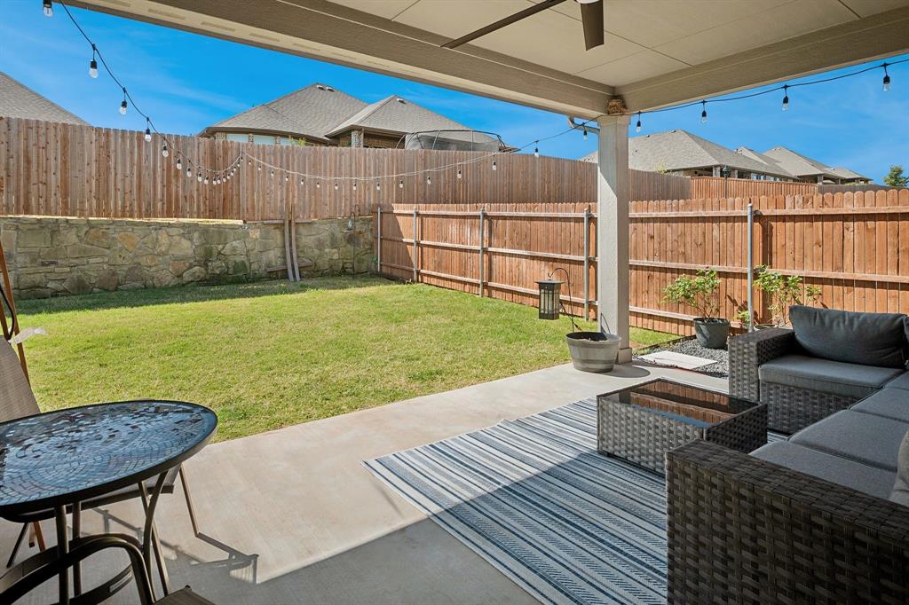 15057 Ted Trail Aledo, TX 76008 - Photo 29 of 35 The private backyard with a covered patio for taking the party outside