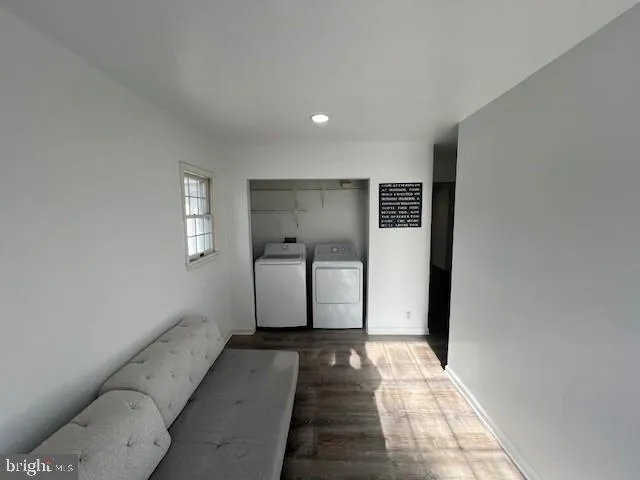 a view of hallway with window and a couch