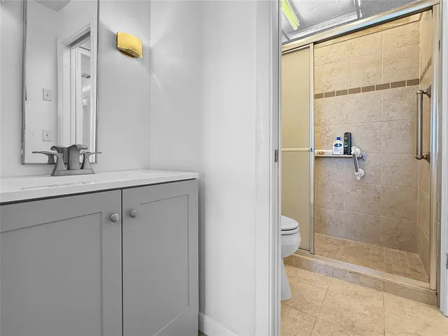 a bathroom with a sink and a shower