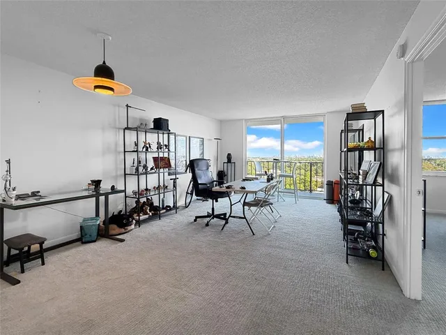 a reading room with furniture and gym equipment