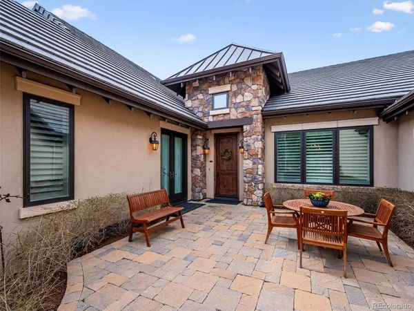 a outdoor living space with furniture and a fireplace