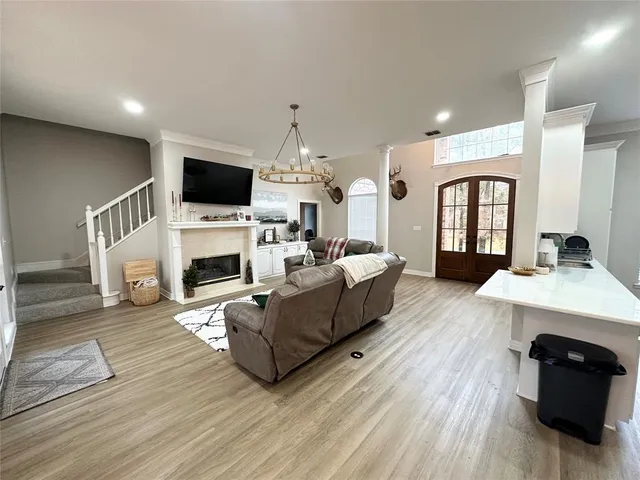 a living room with furniture fireplace and flat screen tv