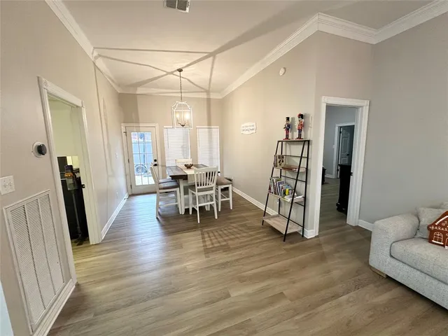 a view of a livingroom with furniture and a wooden floor