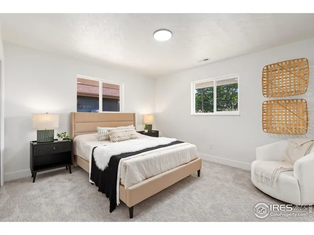 a bedroom with a bed and a couch