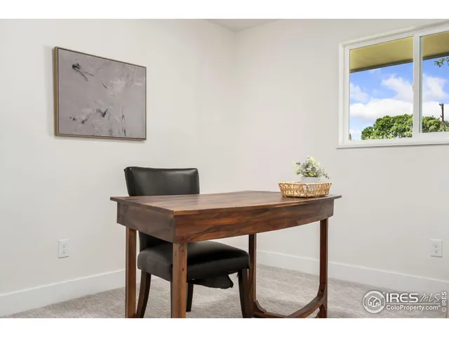 a view of a workspace with furniture