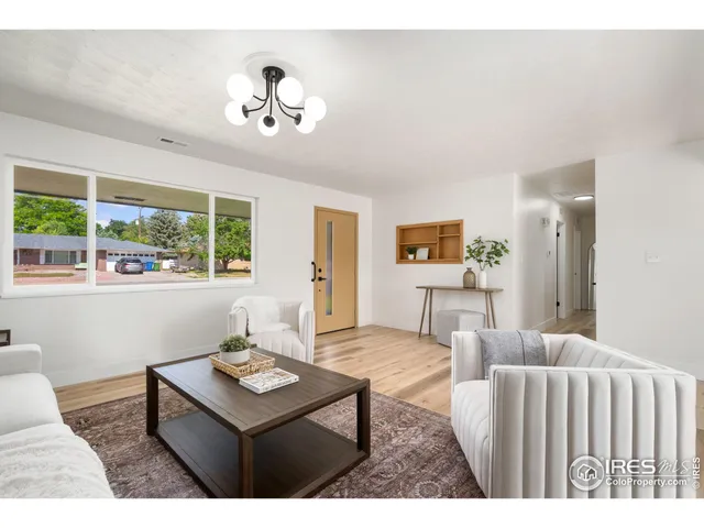 a living room with furniture and window