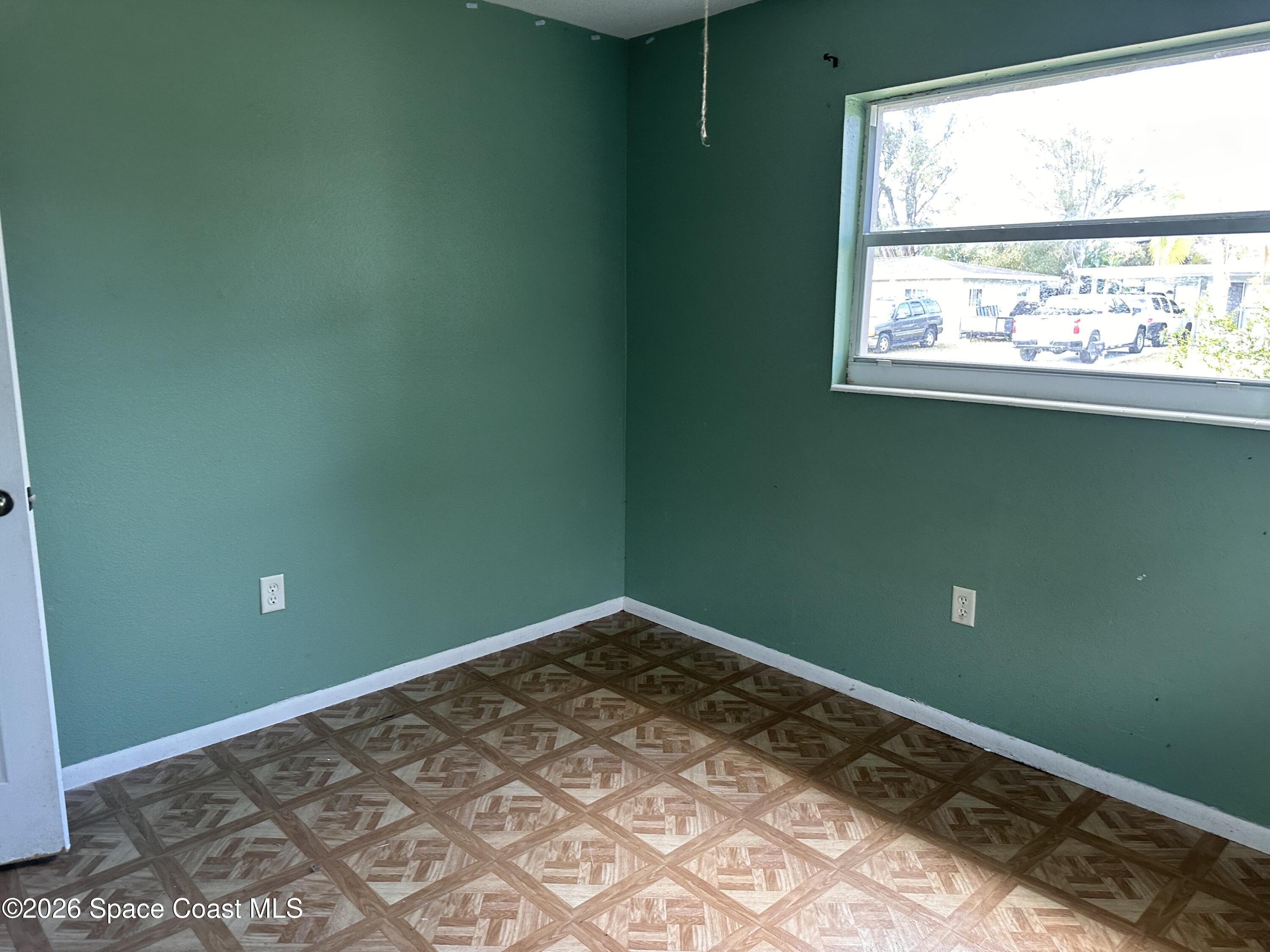 2363 Apache Drive Melbourne, FL 32935 - Photo 18 of 18 a view of a room with a window and a ceiling fan