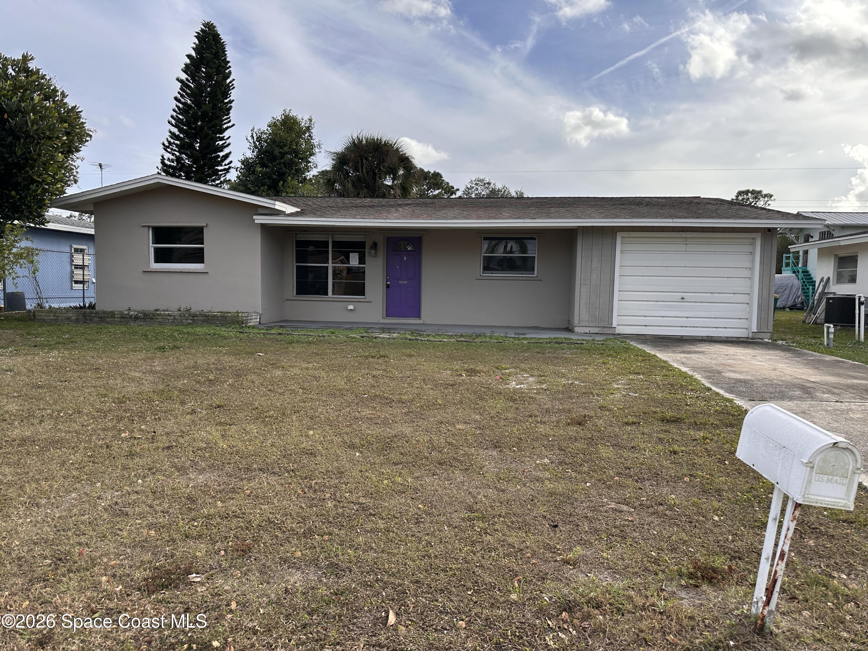 2363 Apache Drive Melbourne, FL 32935 - Photo 2 of 18 a view of a house with a garage