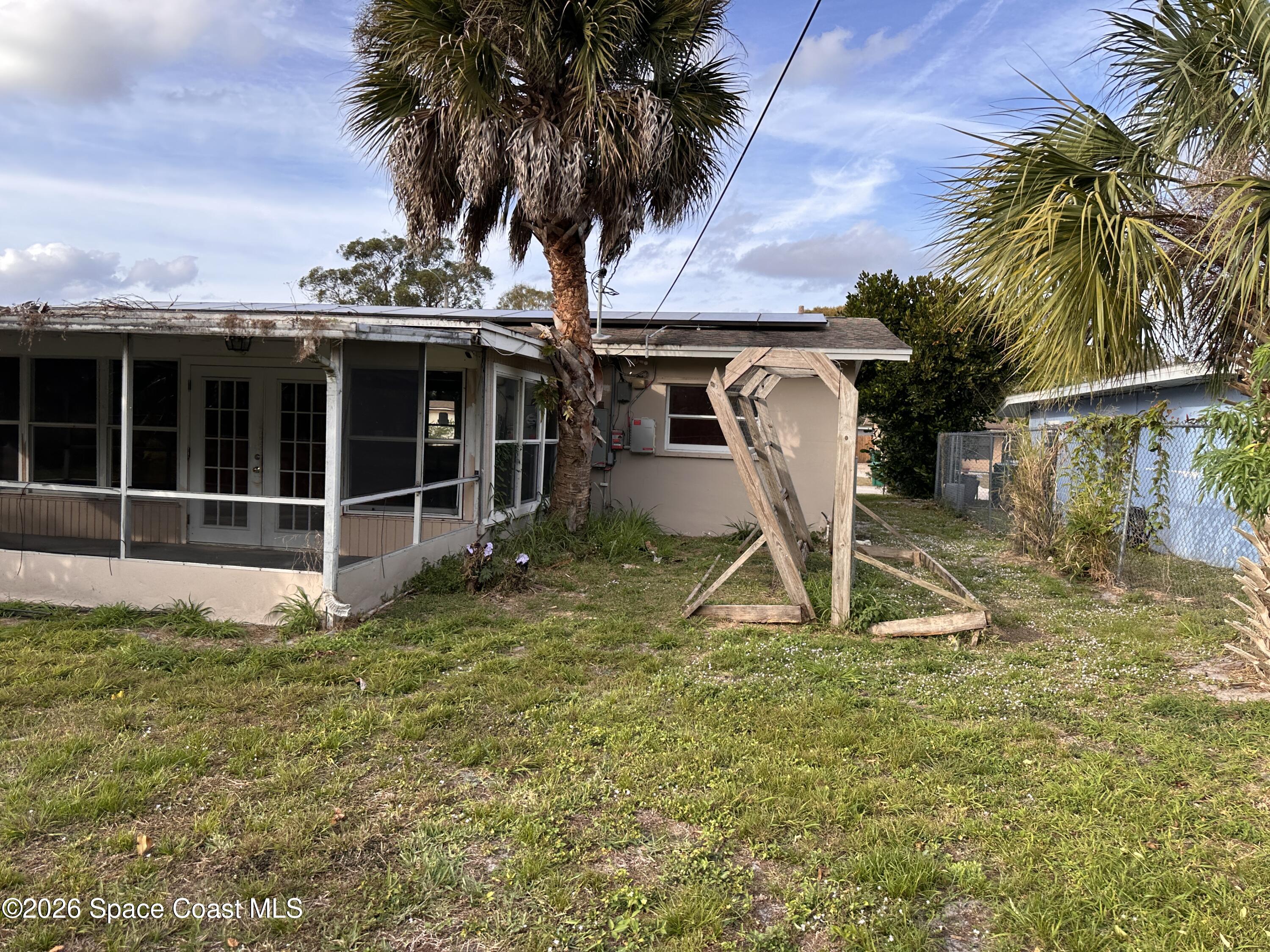 2363 Apache Drive Melbourne, FL 32935 - Photo 4 of 18 a view of a backyard with potted plants