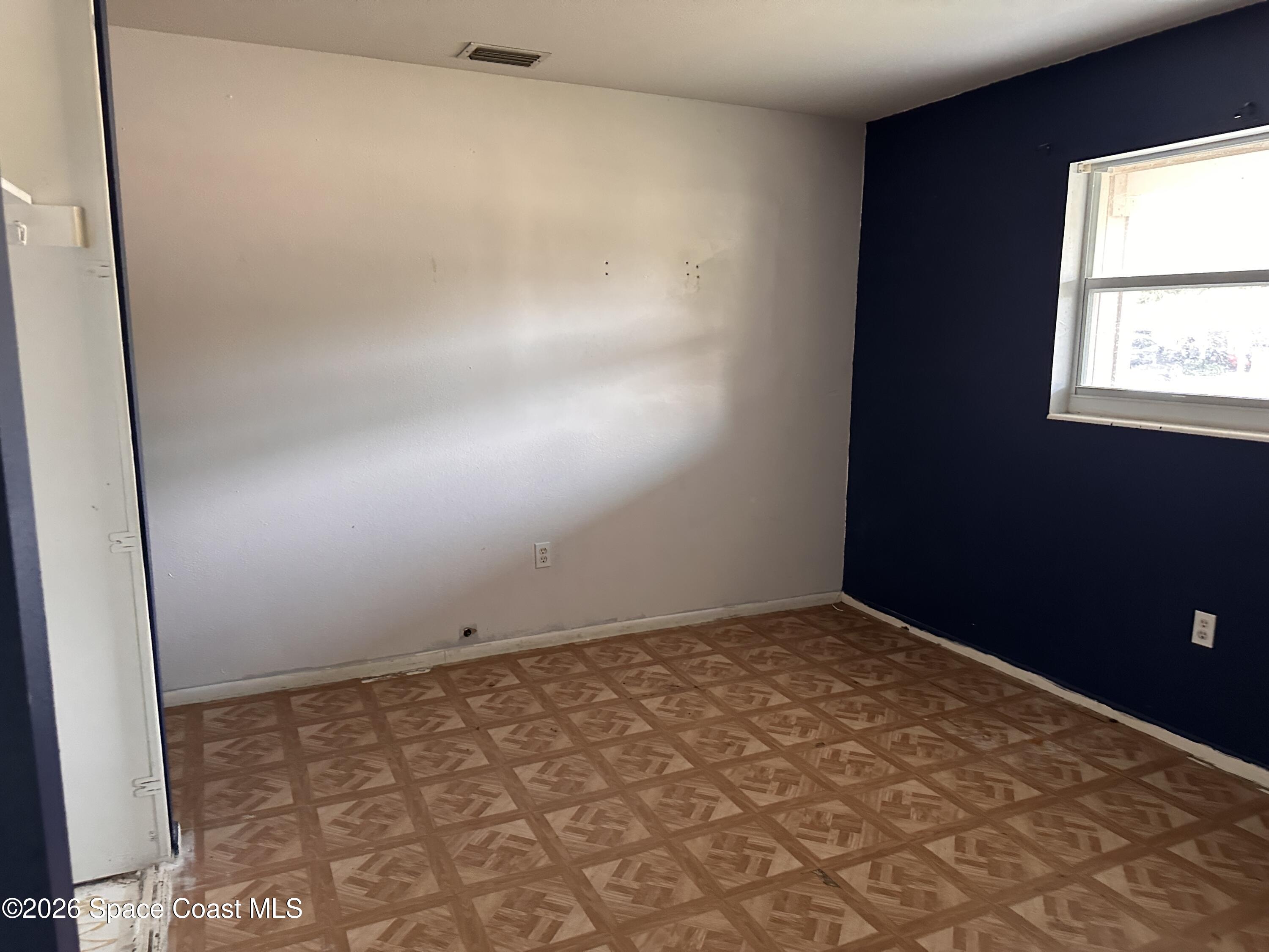 2363 Apache Drive Melbourne, FL 32935 - Photo 10 of 18 an empty room with a window