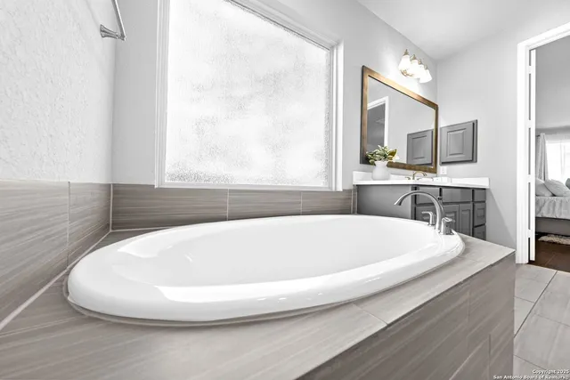 a bathroom with a sink a toilet and shower curtain