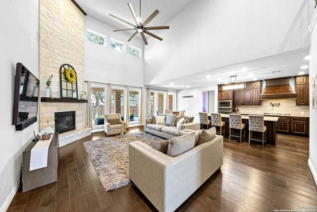 a living room with furniture fireplace and flat screen tv