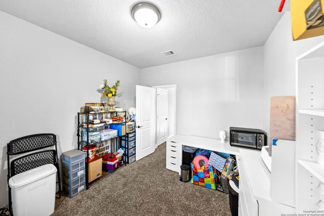 a en suite bathroom with a sink and a mirror
