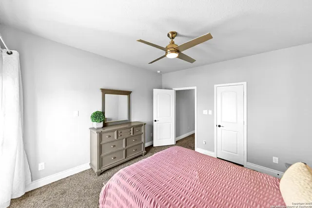 a bedroom with a bed and a cabinets