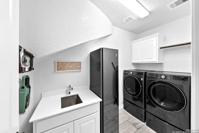 an aerial view of a house with a yard and seating area