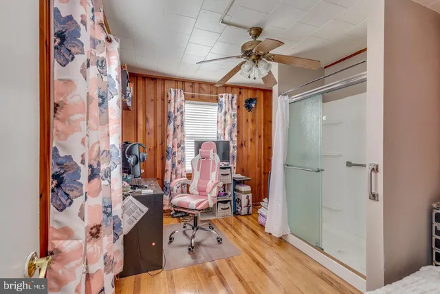a view of a room with window and furniture