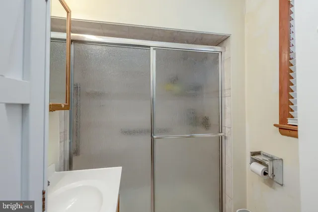 a bathroom with a shower and toilet
