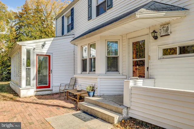 a view of a patio with couches chairs and a fire pit