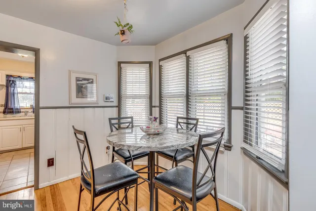 a view of a dining room with furniture and window