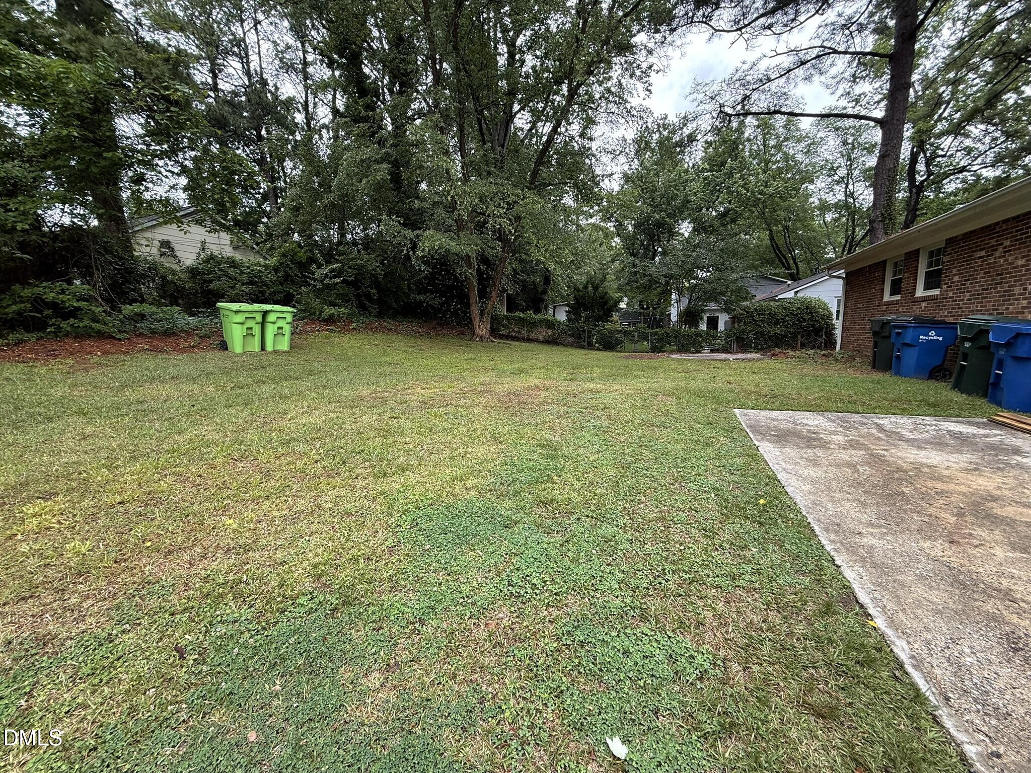 4717 Radcliff Road Raleigh, NC 27609 - Photo 11 of 11 a backyard of a house with lots of green space