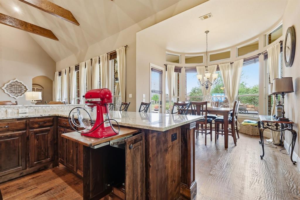 406 Spurgin Road Lucas, TX 75002 - Photo 11 of 39 a view of a dining room with furniture window and wooden floor